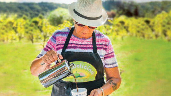 Anthea Raven pours a cup of Coffig (fig coffee) at one of the orchard's Figgy Morning Teas. Photo by Josie Gritten.