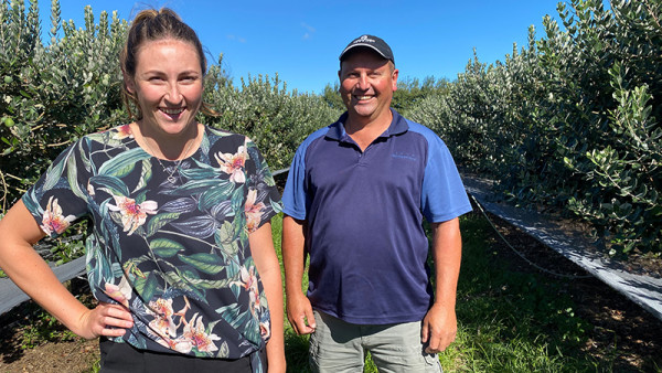 Kaiaponi Farms’ domestic sales lead Olivia Abernethy and fruit procurement manager David Hansen at the eight-hectare Hexton Block, which the company manages on behalf of owner Barton Witters.